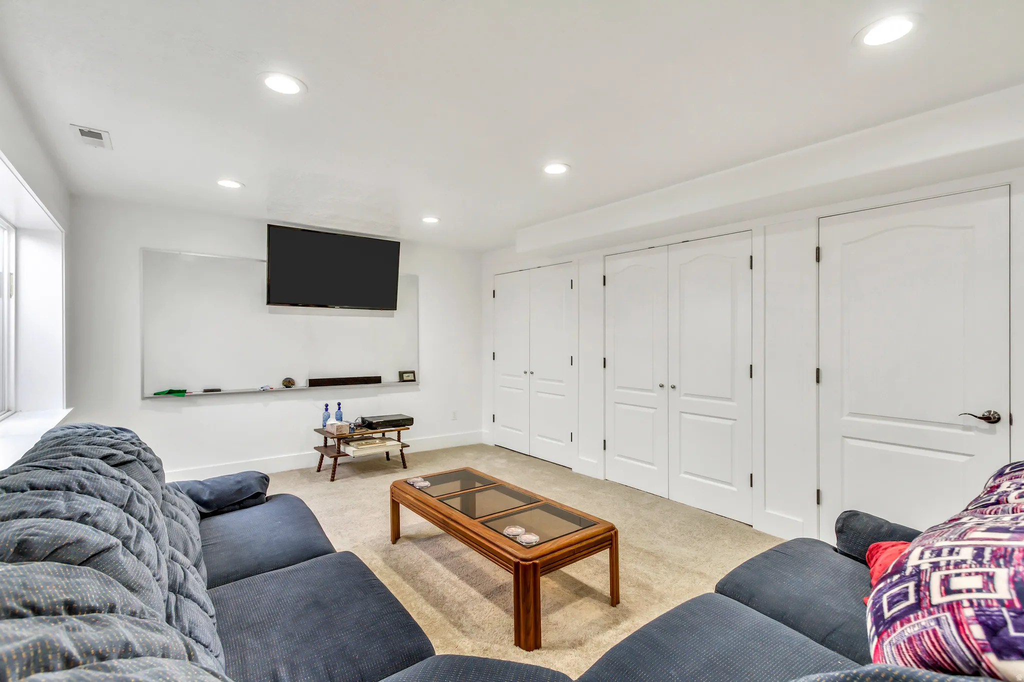Living room featuring light carpet and recessed lighting