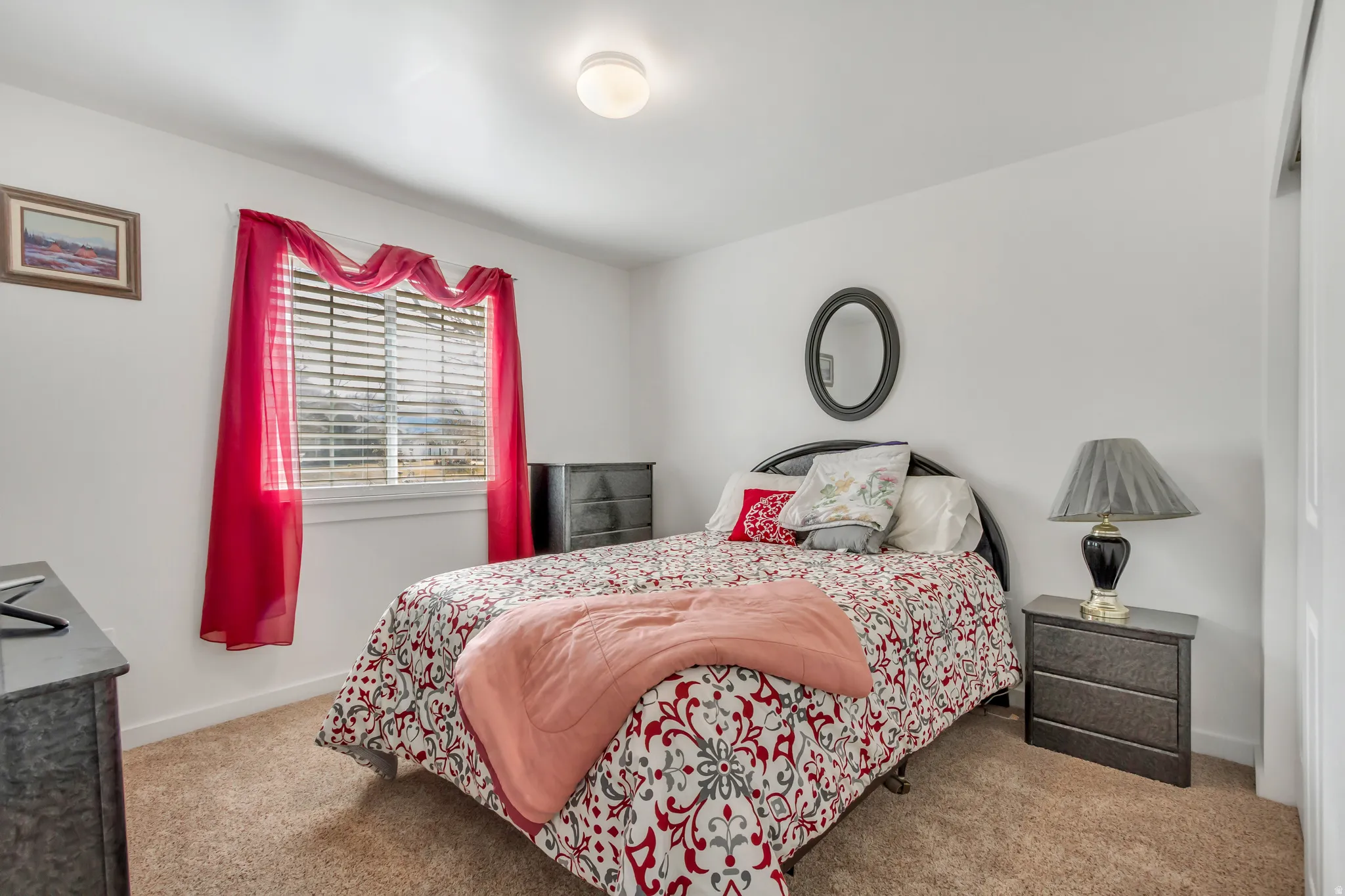 Carpeted bedroom with baseboards