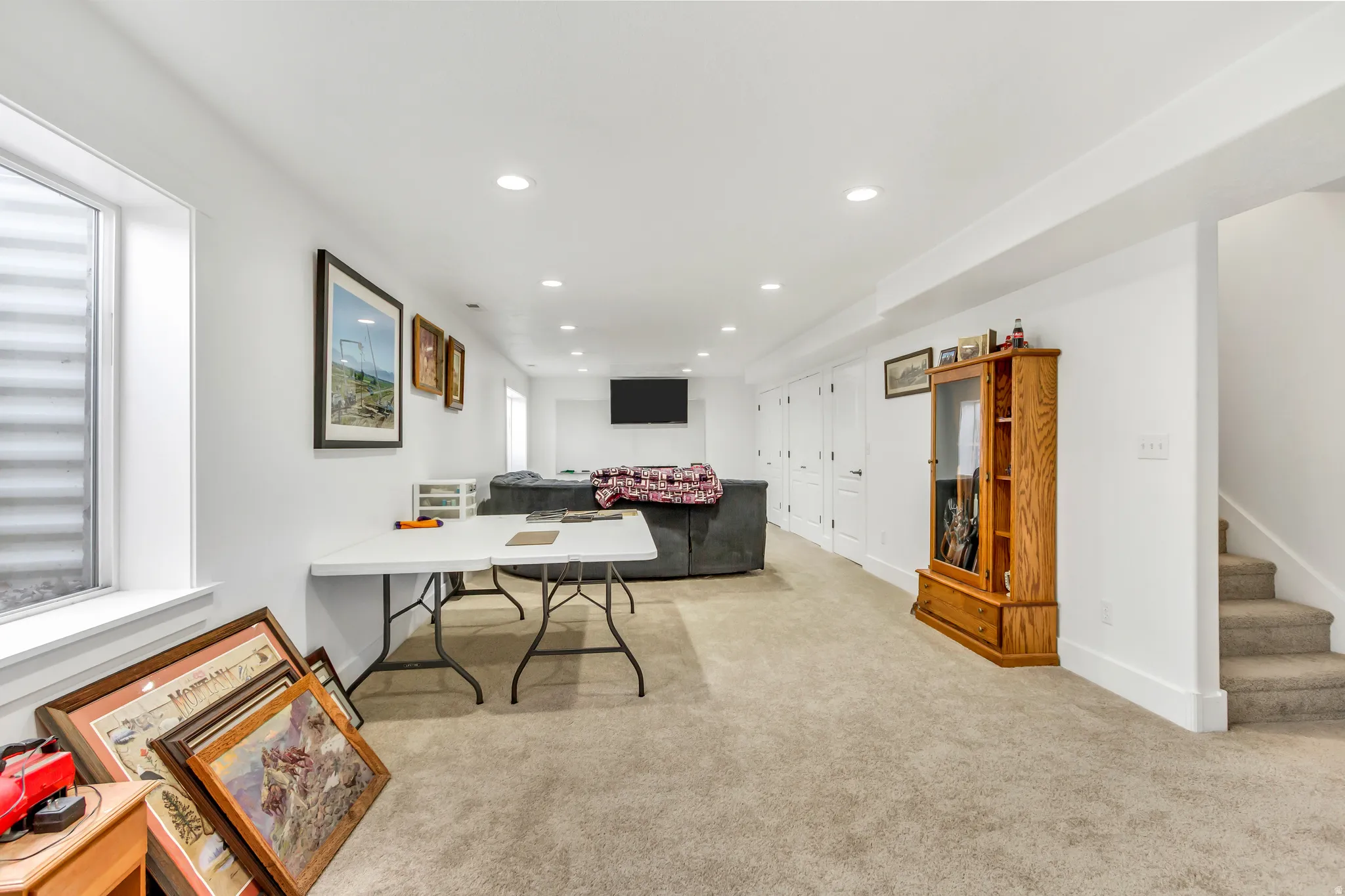 Office area with recessed lighting and light carpet
