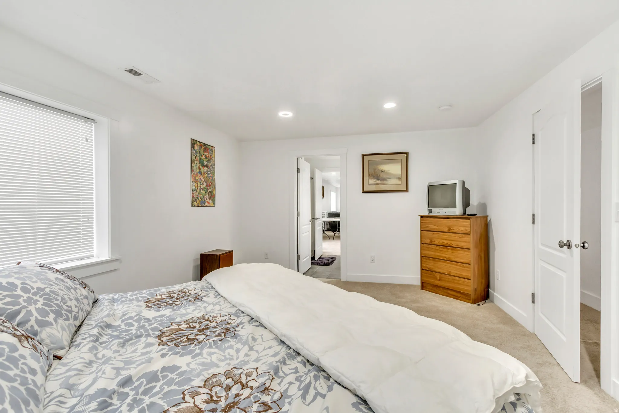 Bedroom featuring light carpet and recessed lighting