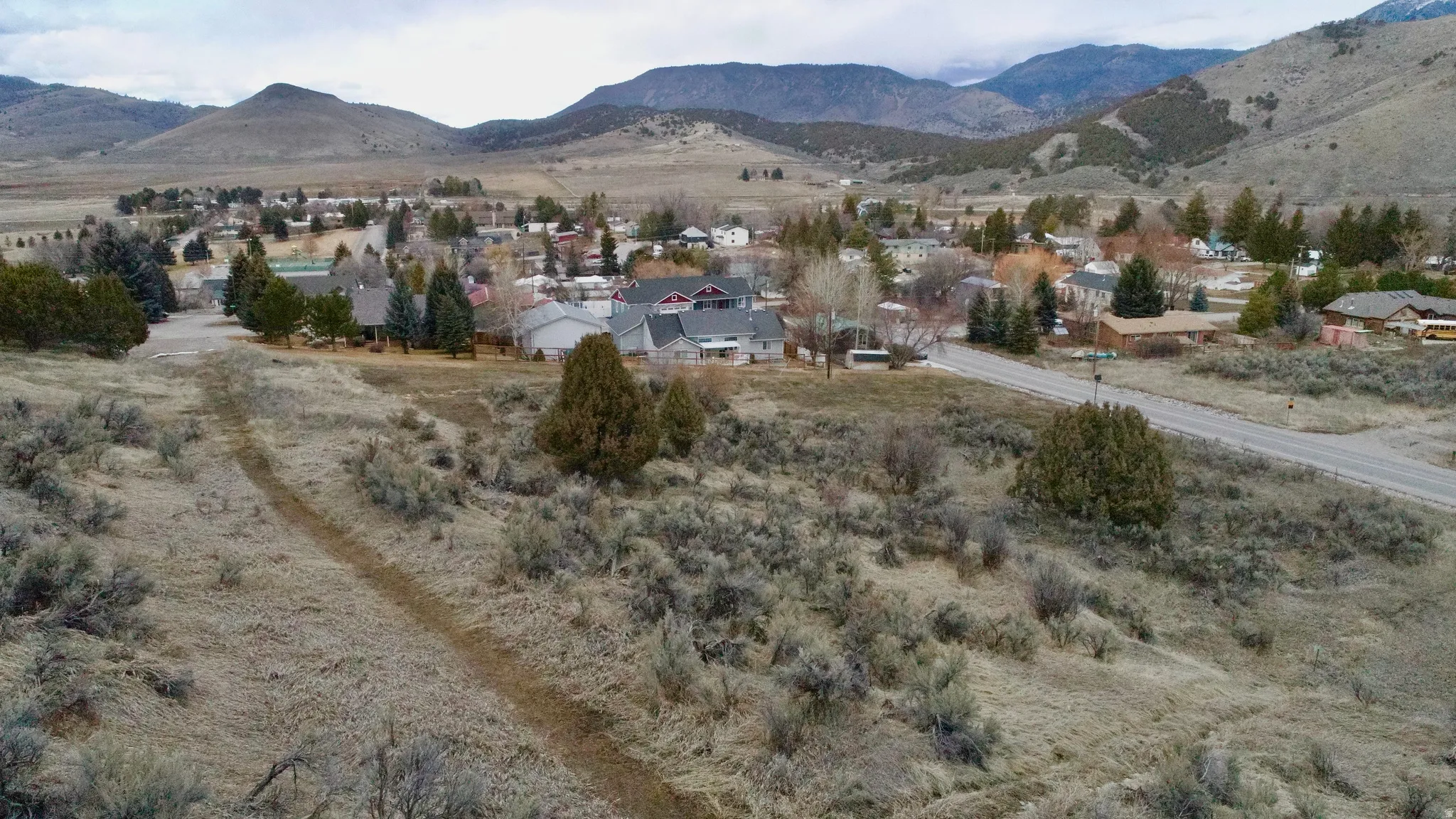 View of mountain background featuring nearby suburban area