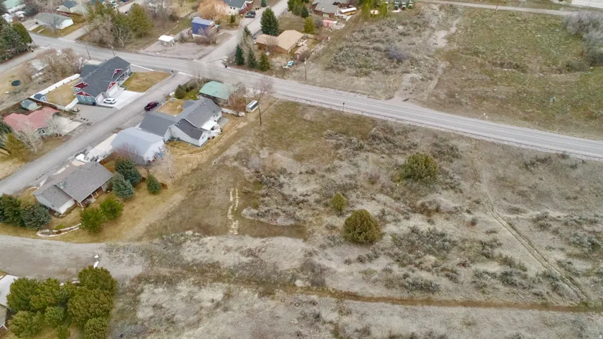 Aerial view of property's location with nearby suburban area