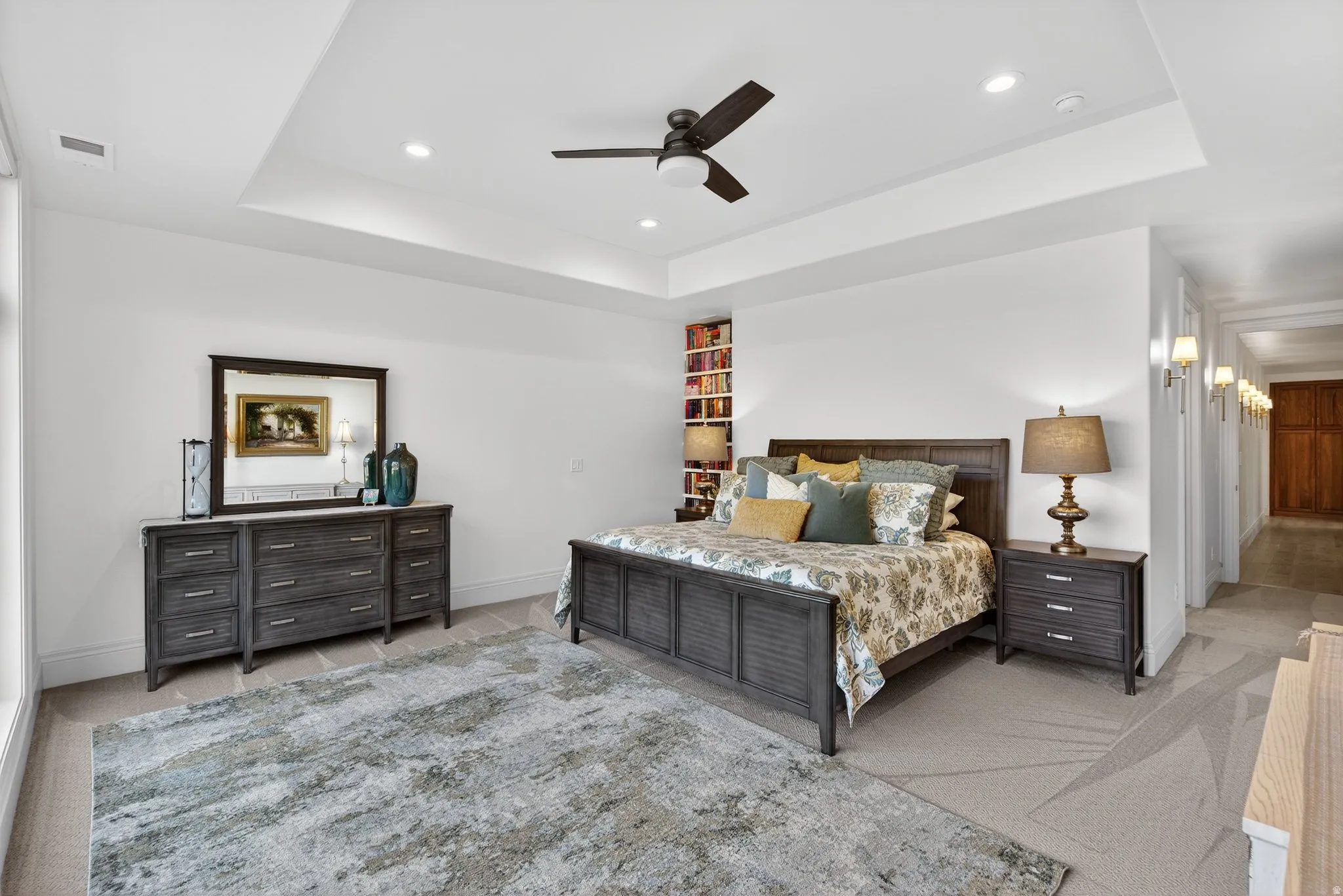 Lower Level Primary Bedroom recessed  ceiling, fan, carpet flooring
