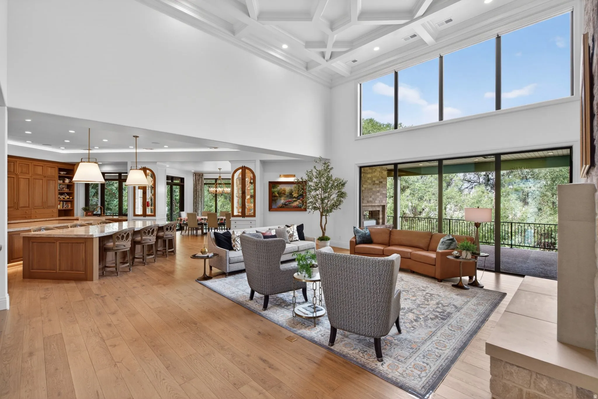 Expansive interior featuring high ceilings with intricate coffered detail and spacious gathering room