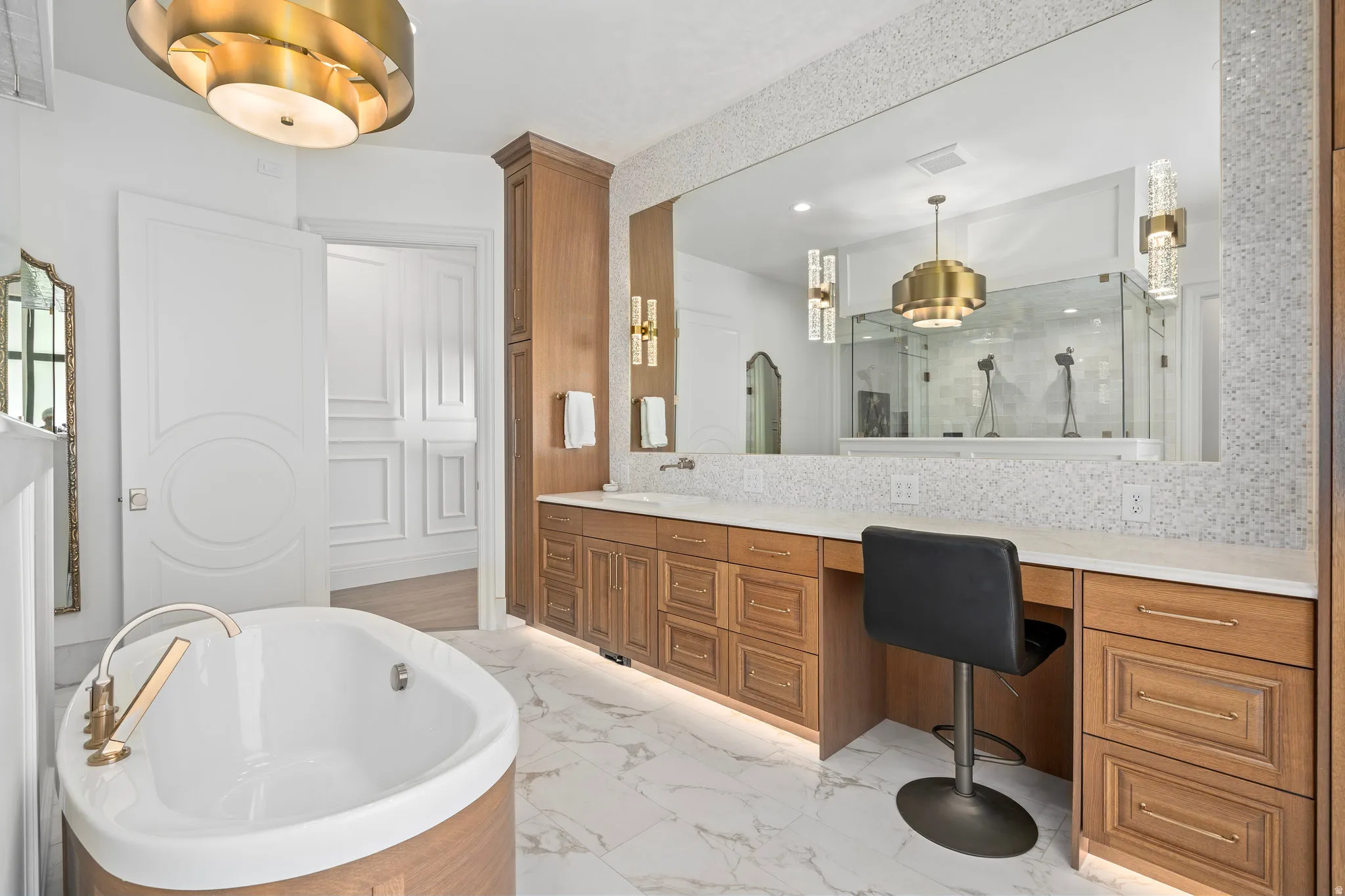 Chandlier over tub, make-up counter, heated floor