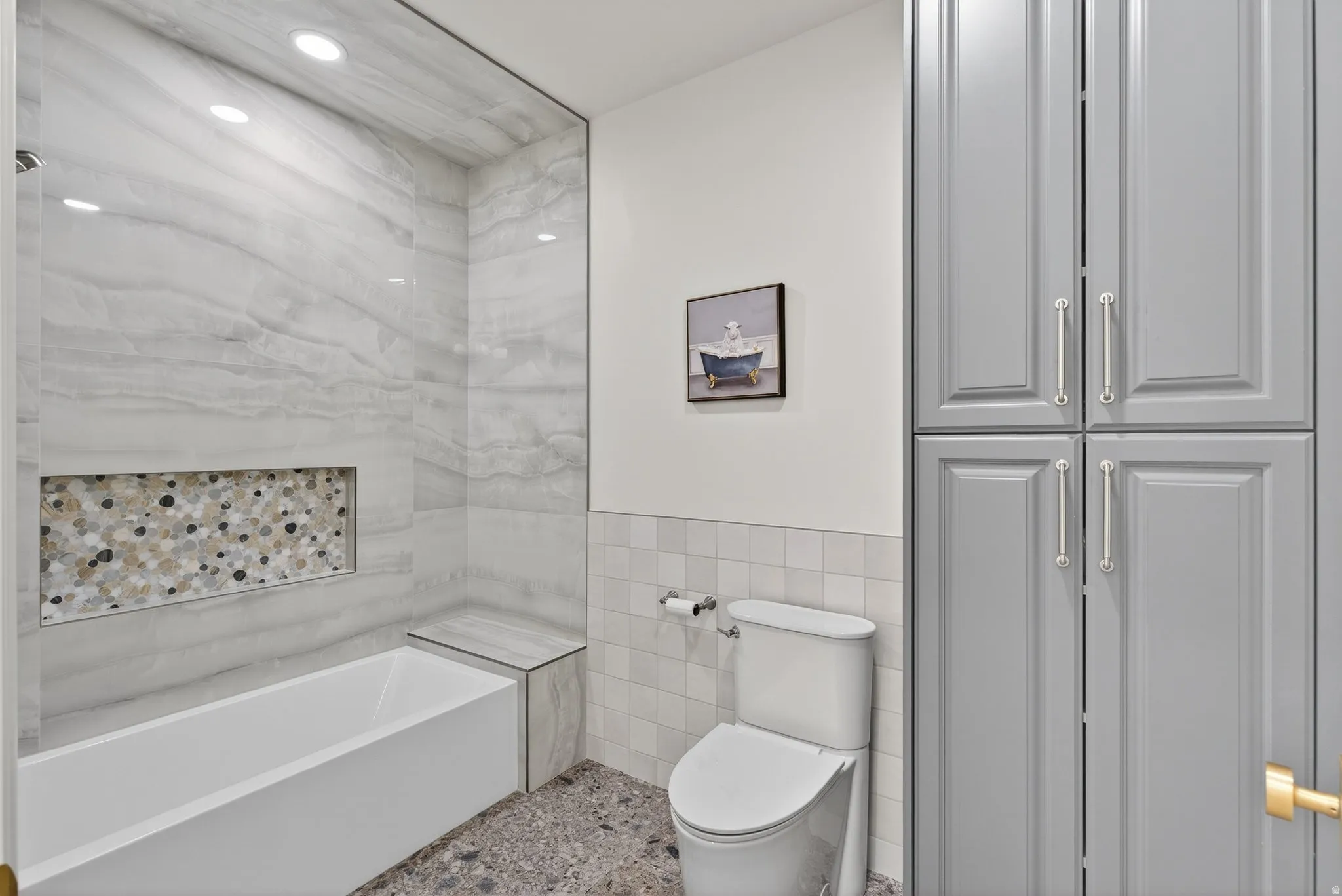 Lower Level Bath with separate room from vanity with cabinet storage