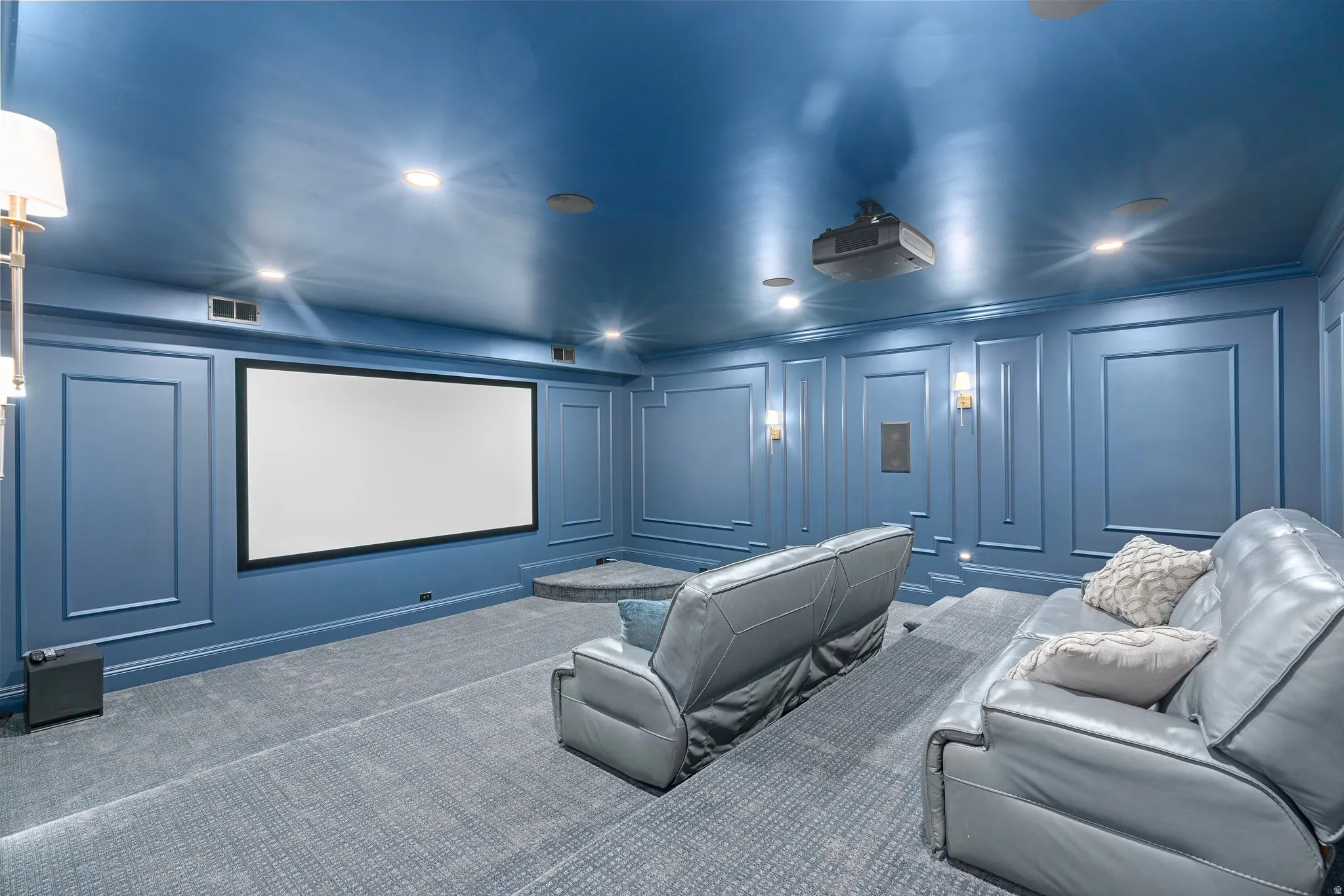 Lower Level Cinema with a decorative wall, carpet floors, recessed lighting, and ornamental molding