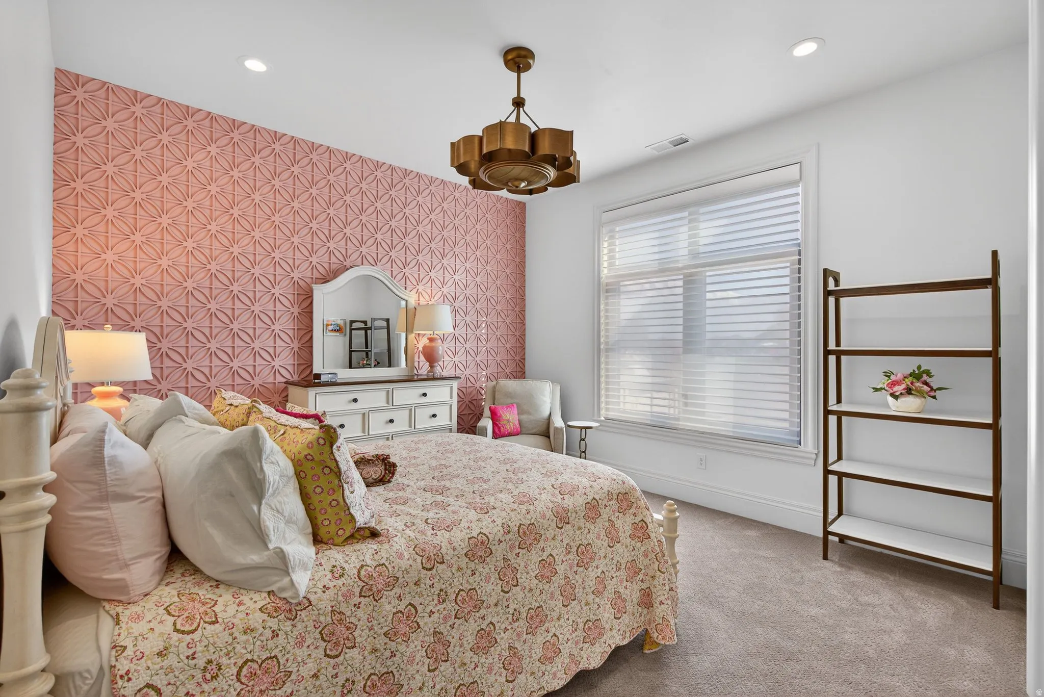 En suite Bedroom featuring accent wall, walk-in closet & bath