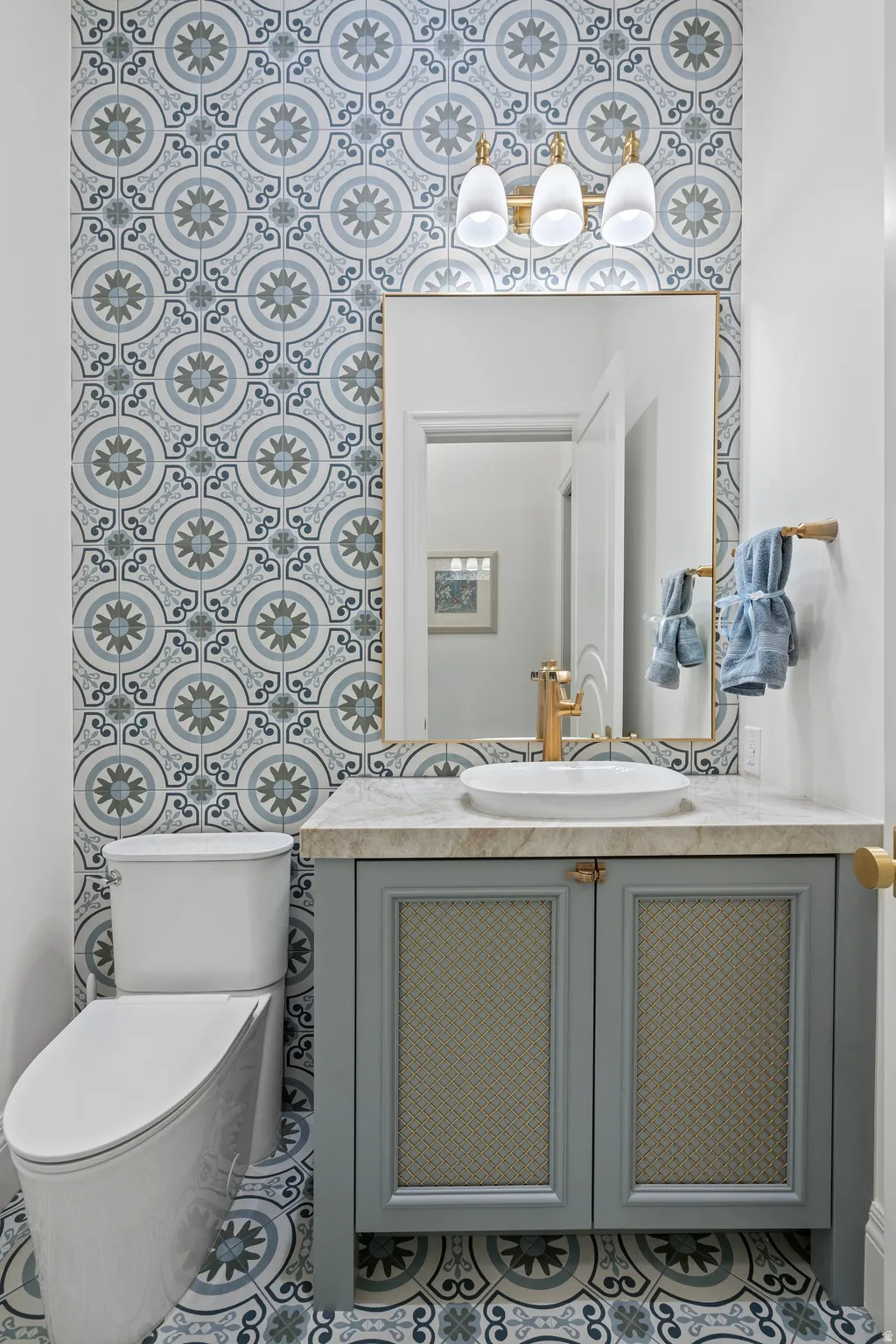 Main Level Half bath with porcelain tiled wall