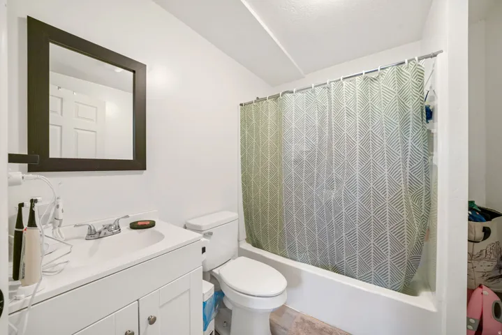 Full bathroom with vanity and shower / tub combo with curtain
