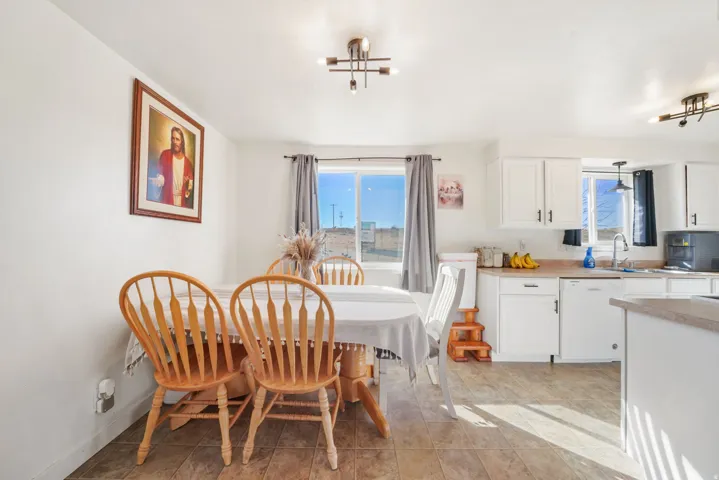 Dining room with light tile patterned flooring