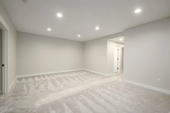 Unfurnished room featuring light colored carpet and recessed lighting