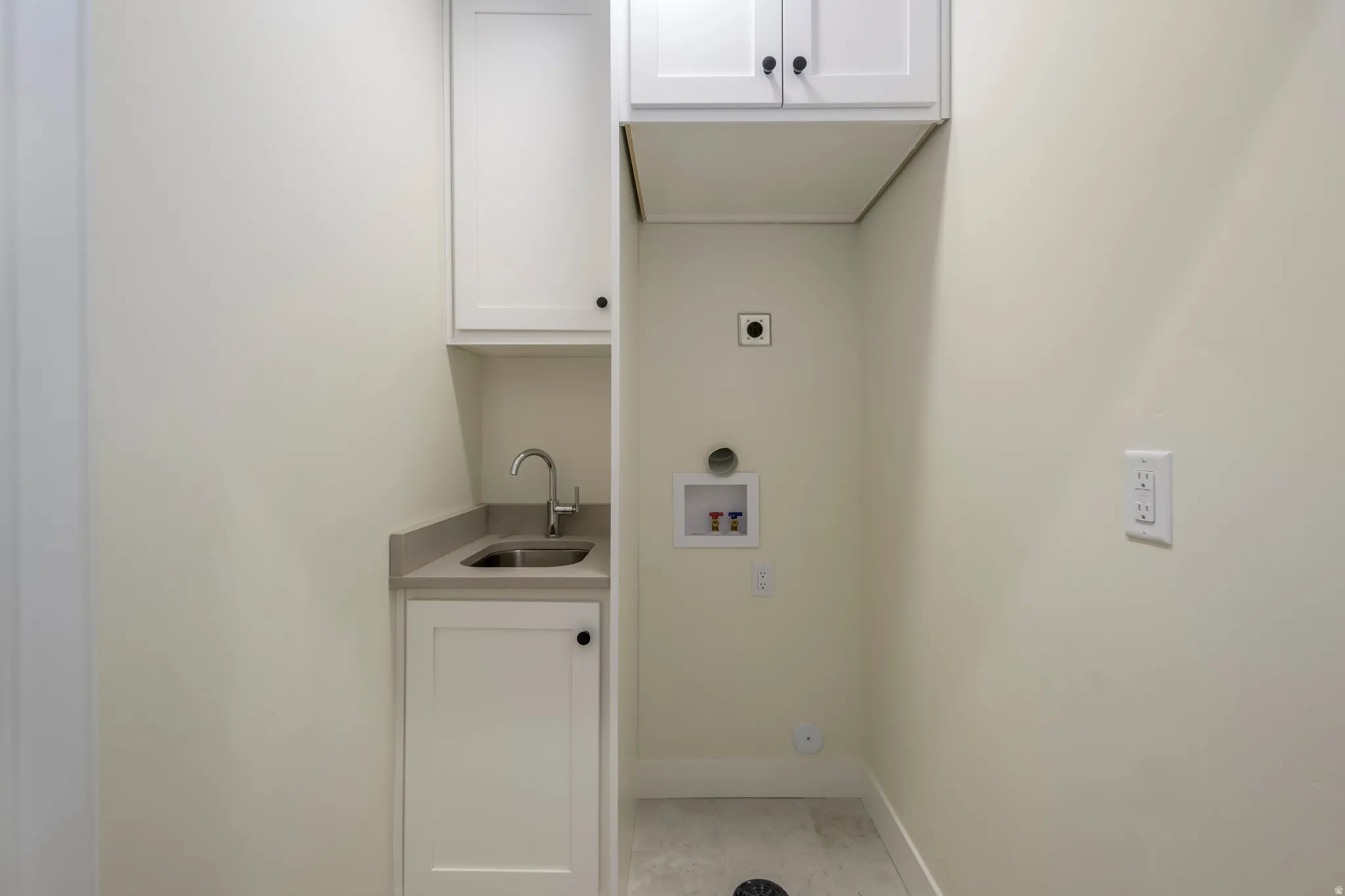 Laundry room with cabinet space, washer hookup, and electric dryer hookup