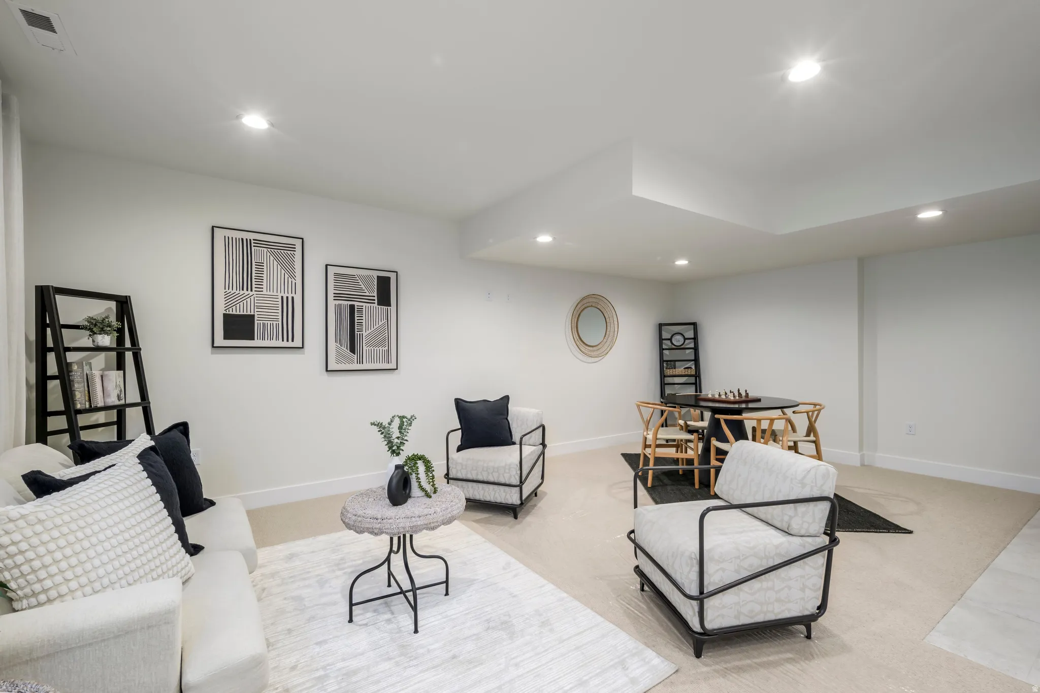 Living area featuring recessed lighting and carpet