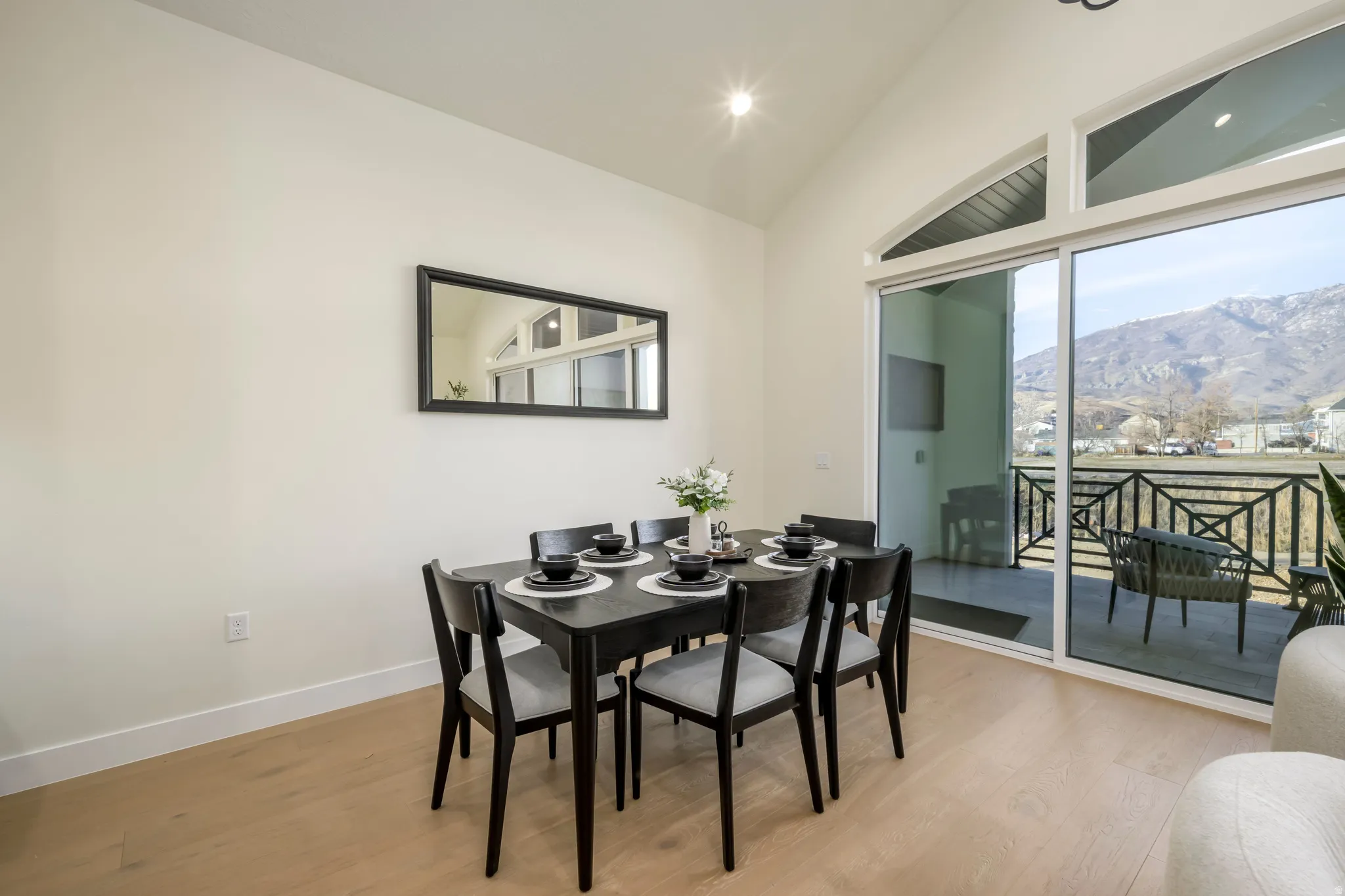 Dining area featuring light wood-type flooring, recessed lighting, and vaulted ceiling