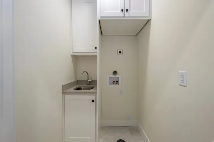 Laundry room with cabinet space, washer hookup, and electric dryer hookup