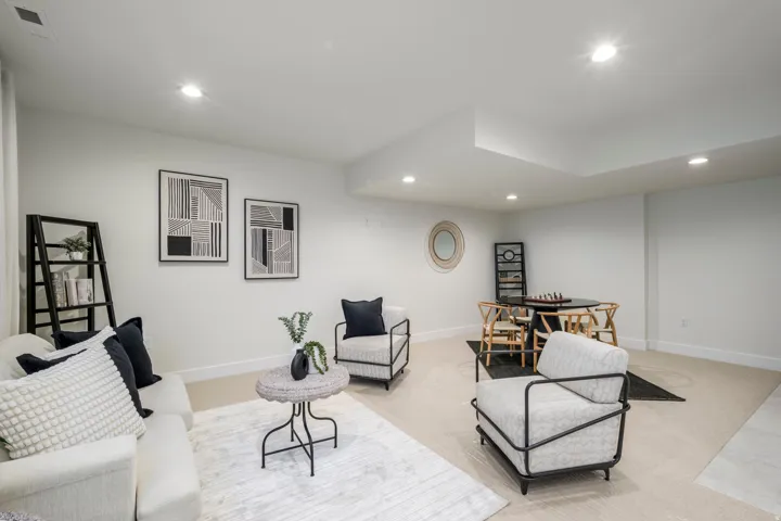 Living area featuring recessed lighting and carpet