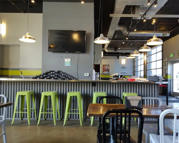 Bar area featuring pendant lighting and a high ceiling