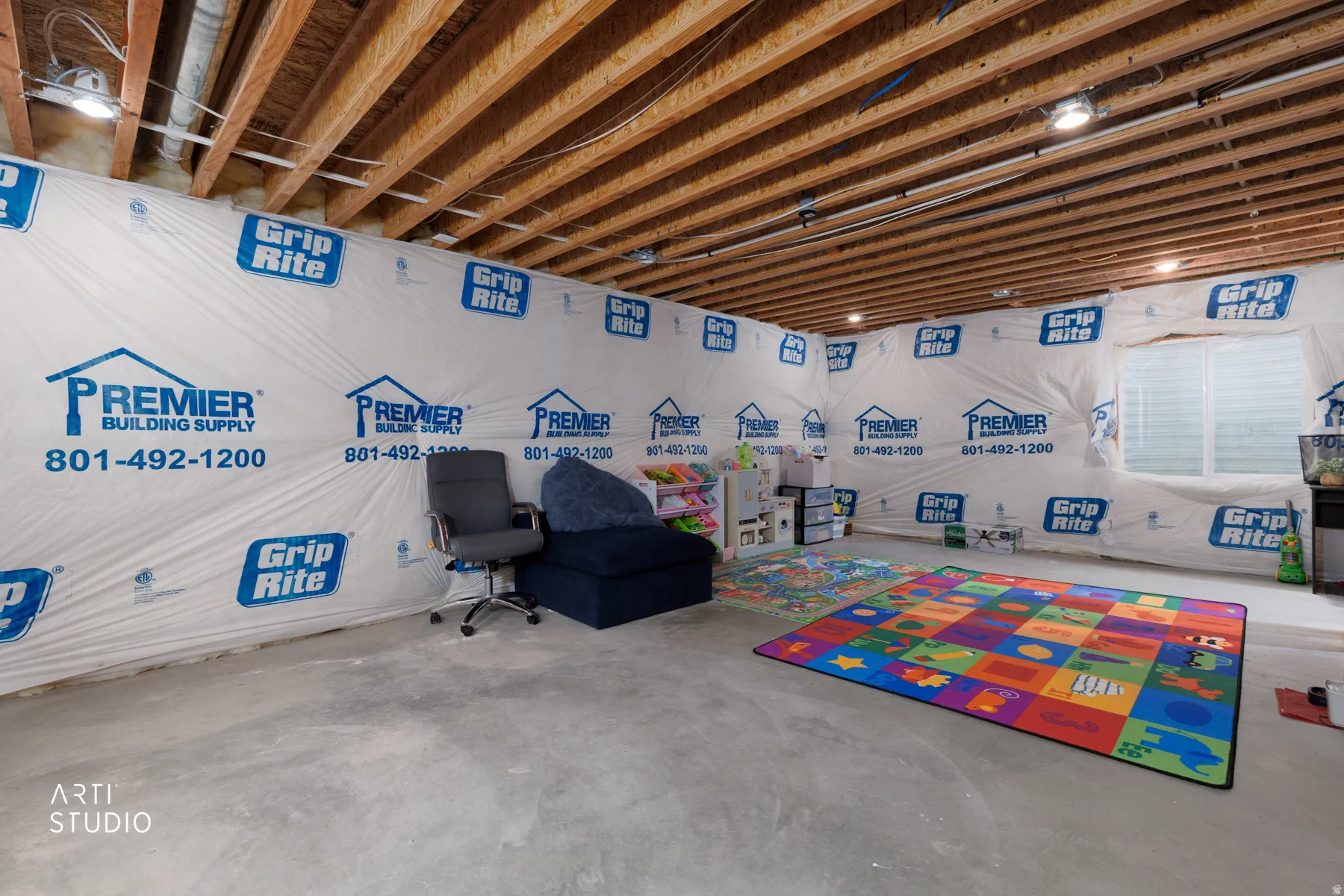 Playroom with unfinished concrete floors