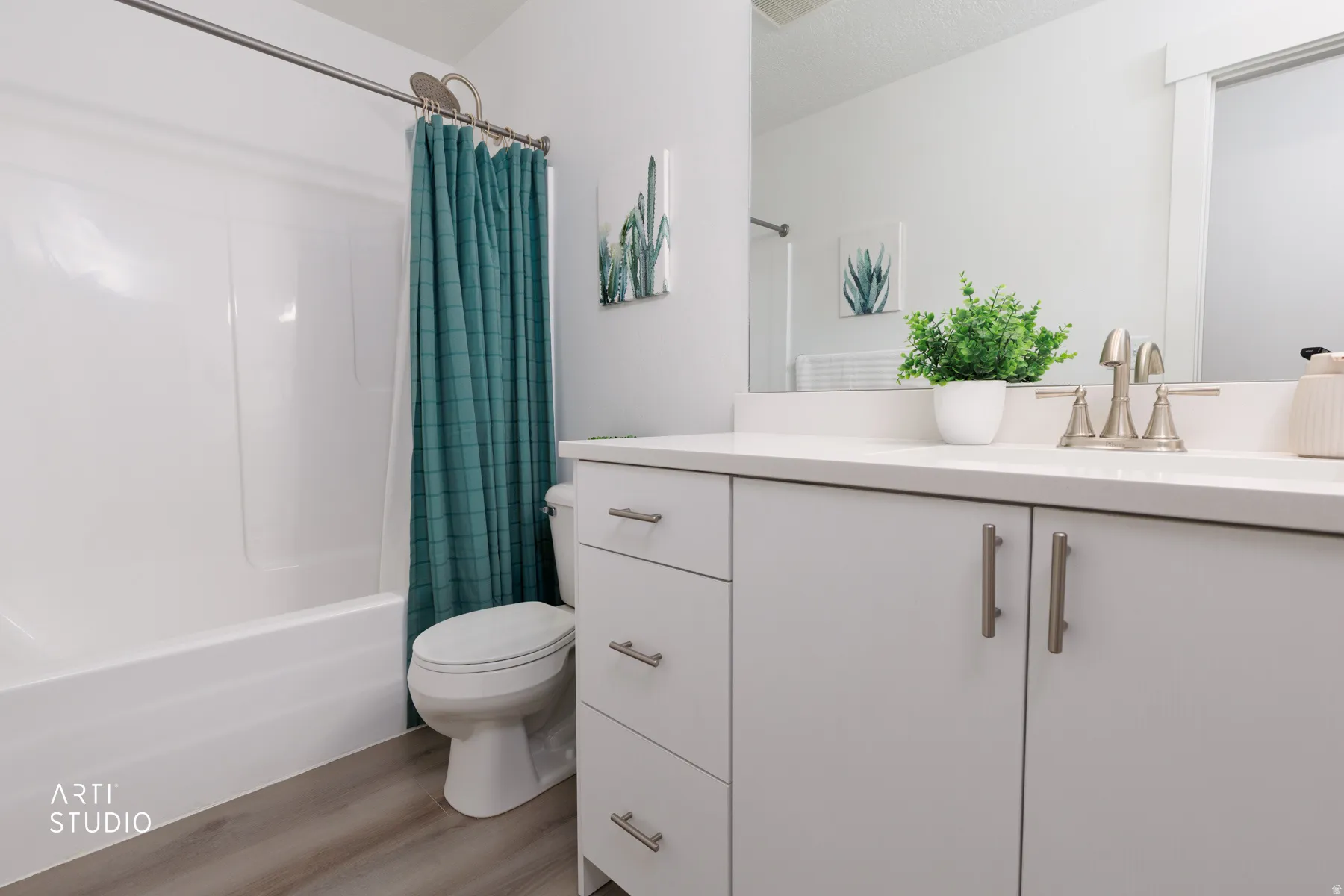 Full bathroom with vanity, light wood finished floors, and shower / bathtub combination with curtain
