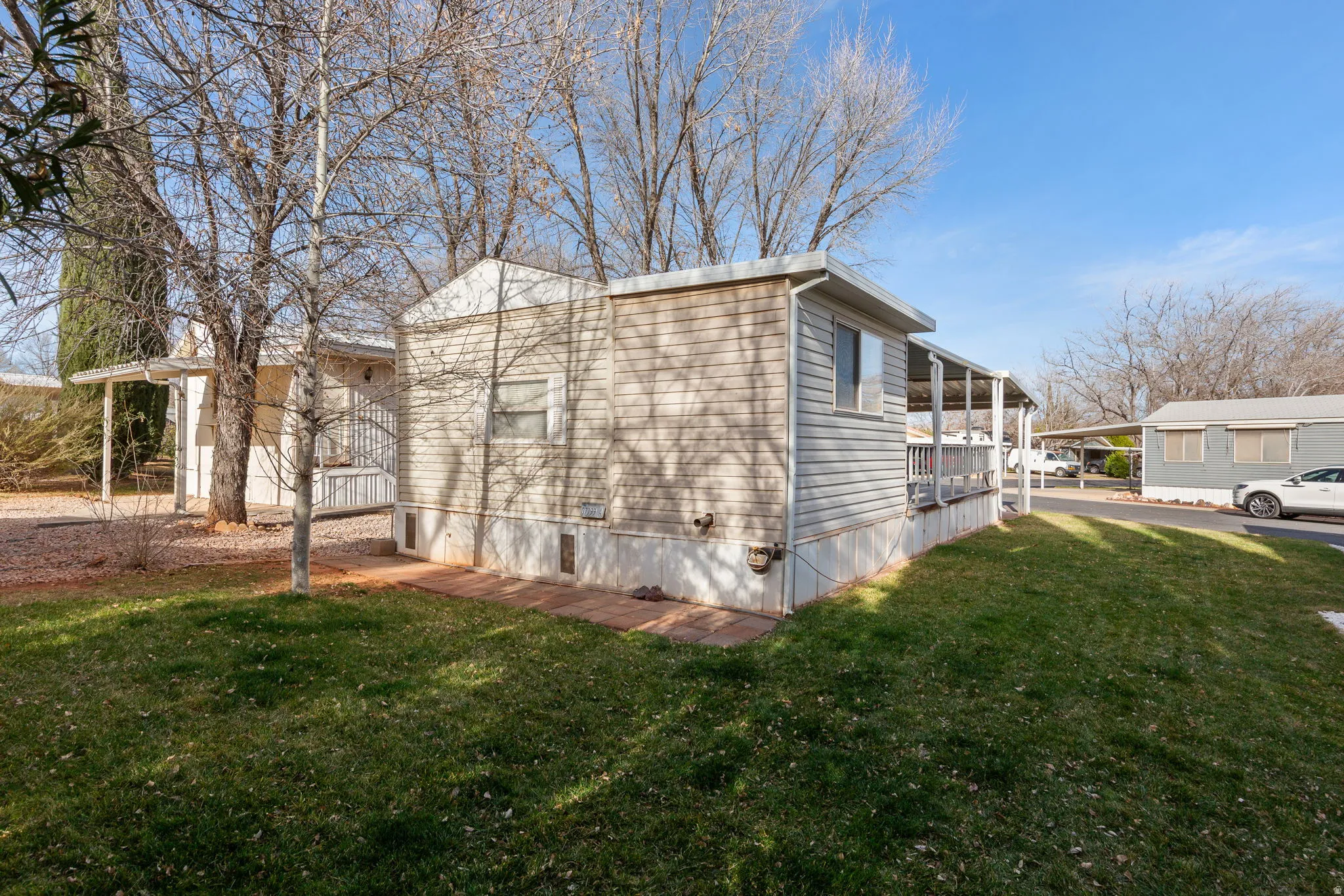 View of side of property with a yard