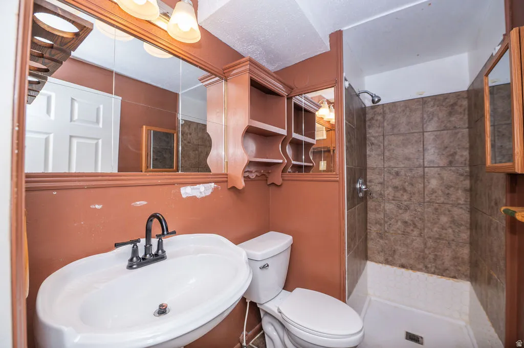 Full bath featuring a stall shower