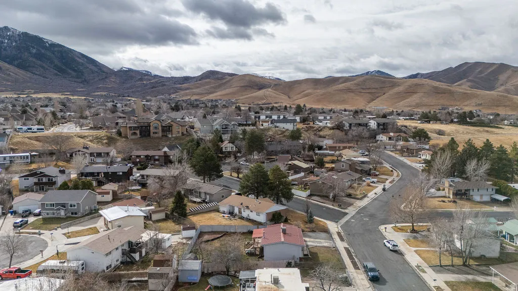 View of mountain backdrop with nearby suburban area