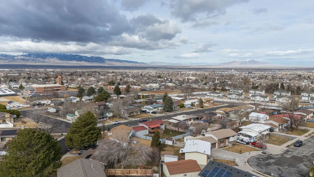 Aerial view of residential area featuring mountains