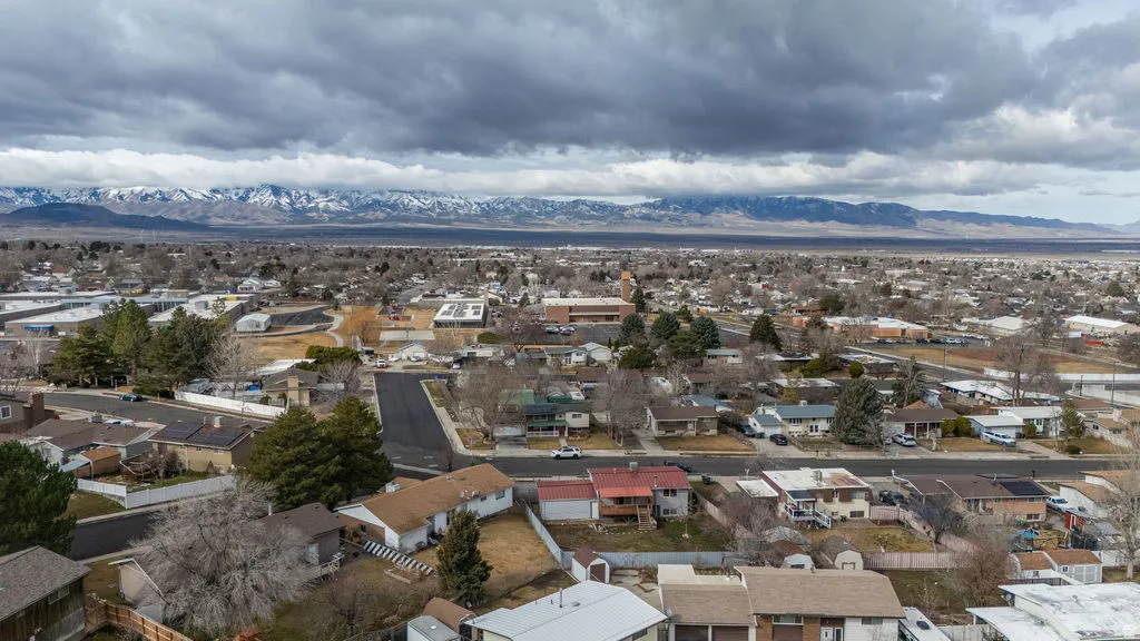 Aerial view of residential area featuring a mountain backdrop