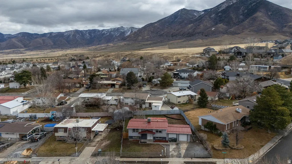 Aerial view of residential area with a mountain backdrop