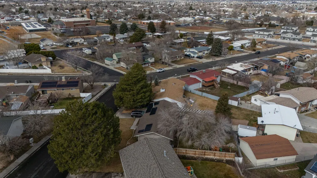 Aerial view of property's location featuring nearby suburban area