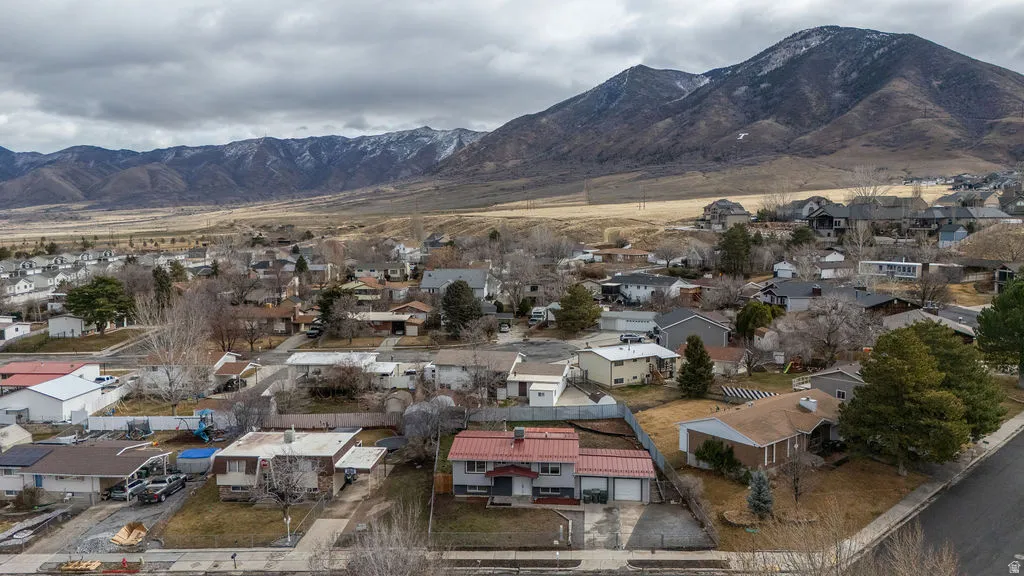 View of mountain background featuring nearby suburban area