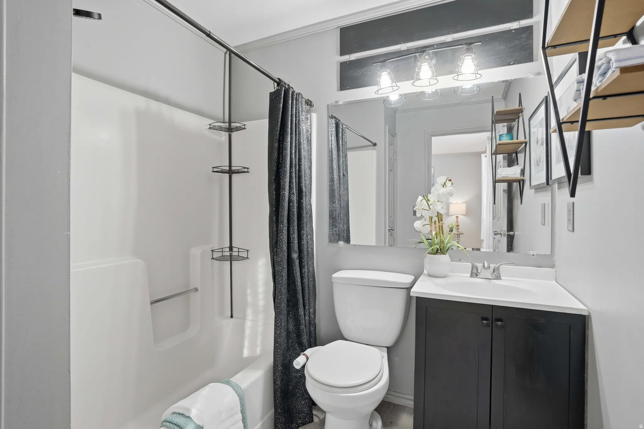 Full bathroom with vanity and shower / tub combo with curtain