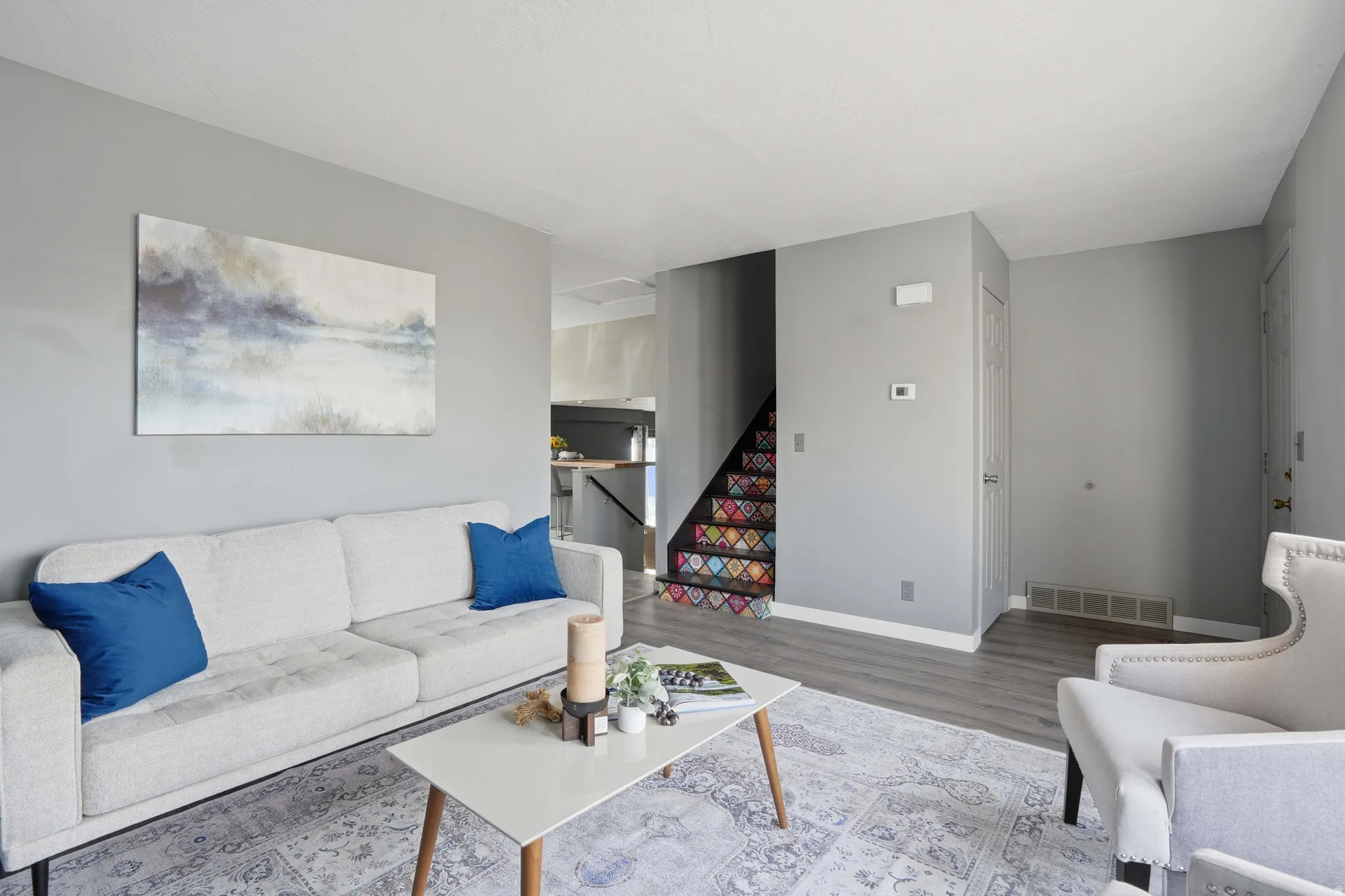 Living room with wood finished floors and baseboards