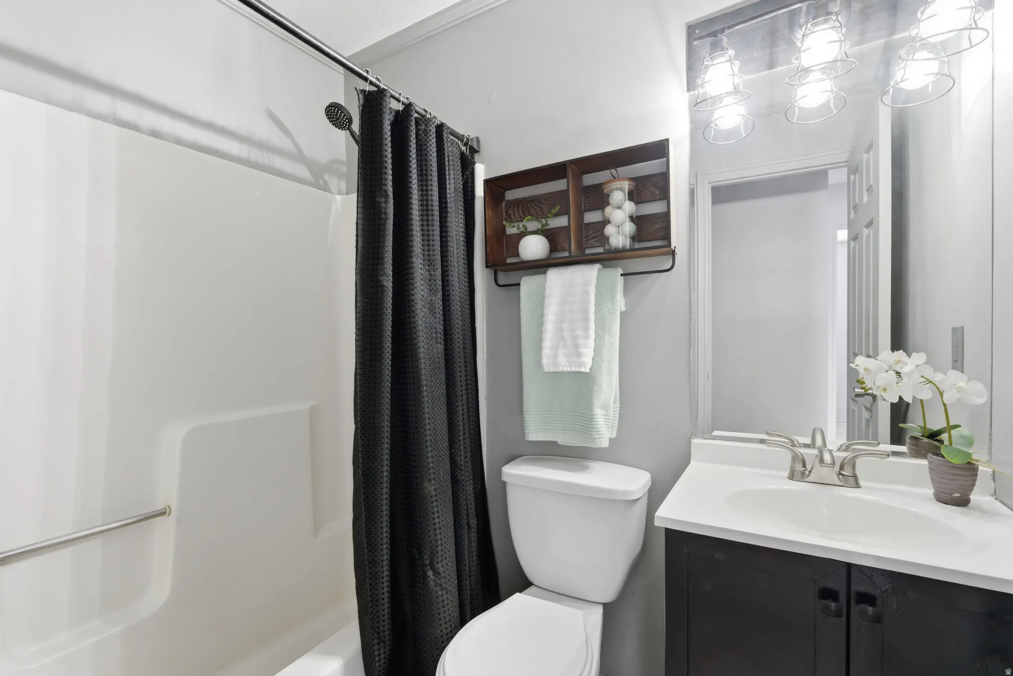 Bathroom with vanity and shower / bath combo