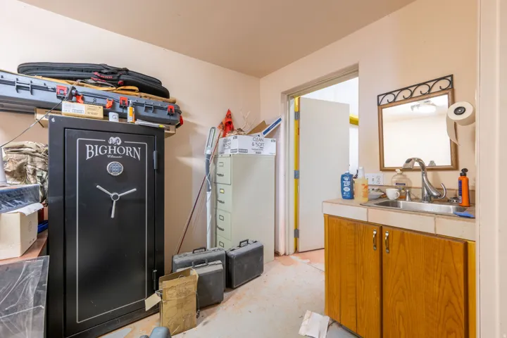 Interior space featuring vanity and concrete floors