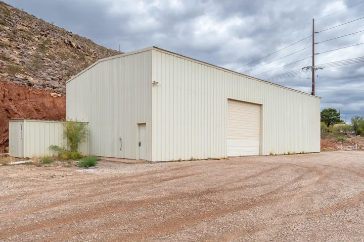View of outbuilding featuring driveway