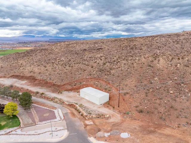 Aerial view of a mountain backdrop and a desert landscape