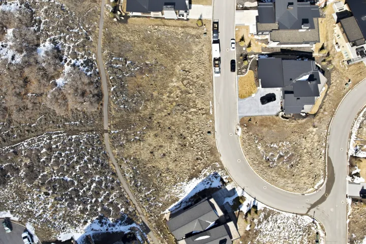 View of property location with nearby suburban area