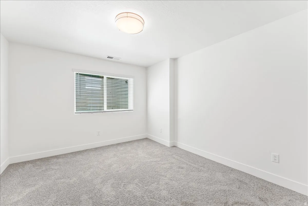 Unfurnished room with baseboards and carpet floors