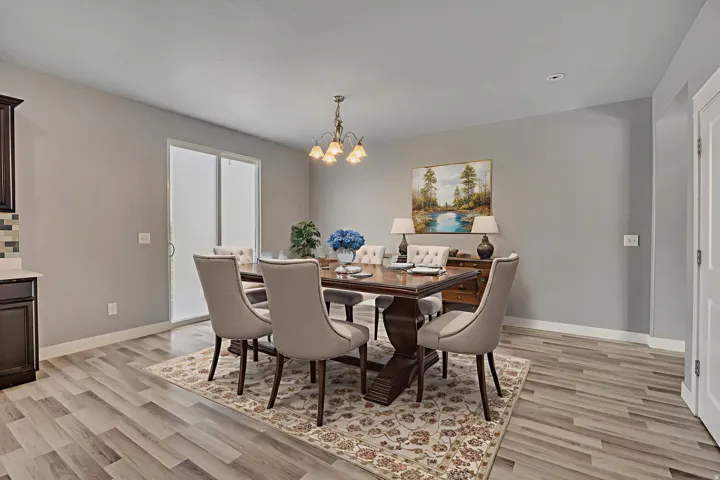 Dining space featuring a chandelier and light wood-type flooring