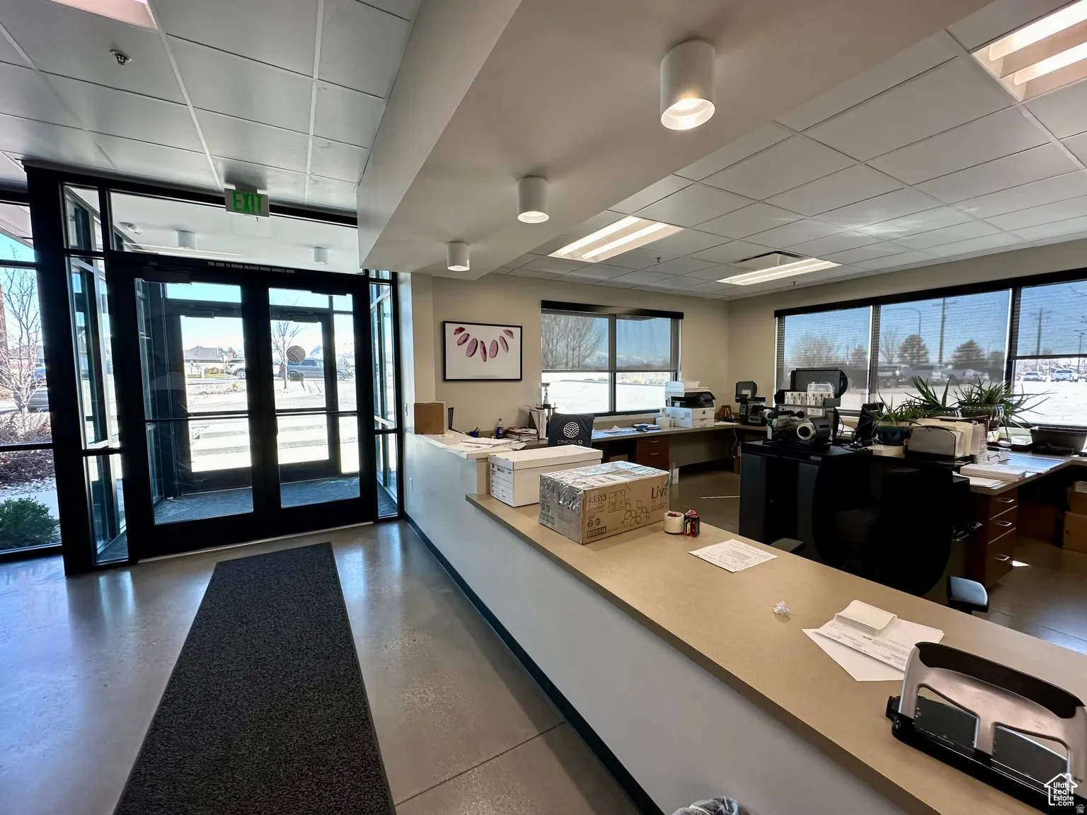Office area with a paneled ceiling