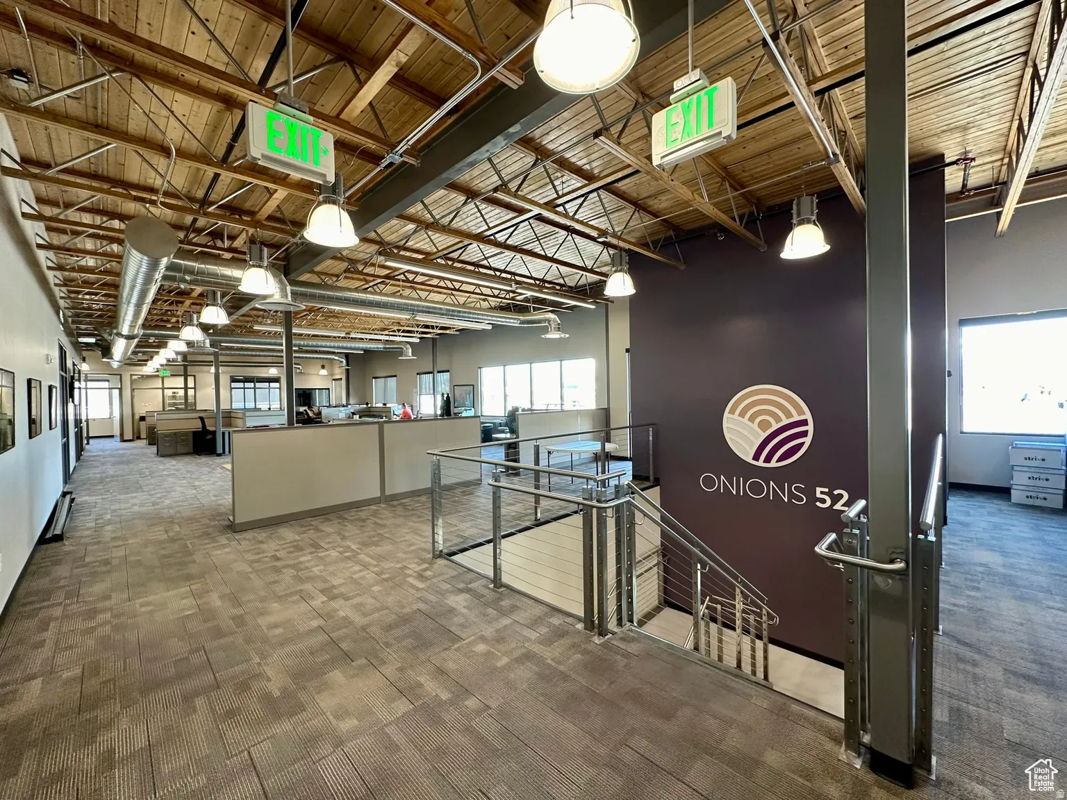 Hall featuring light carpet and wood ceiling
