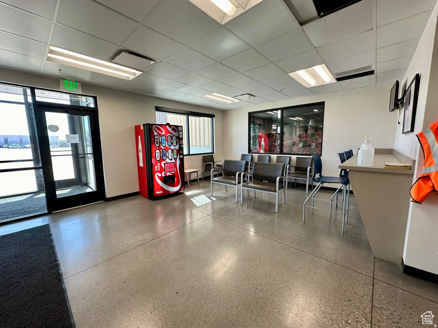 Common area with a paneled ceiling