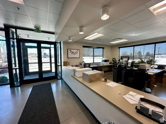 Office area with a paneled ceiling