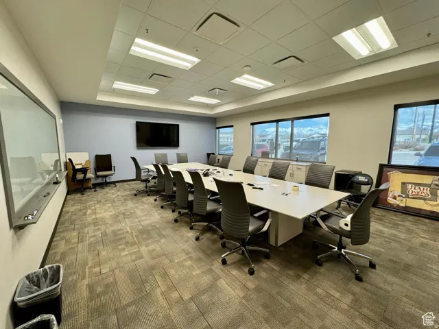 Office space with a paneled ceiling