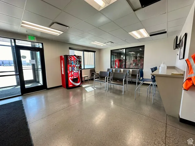 Common area with a paneled ceiling