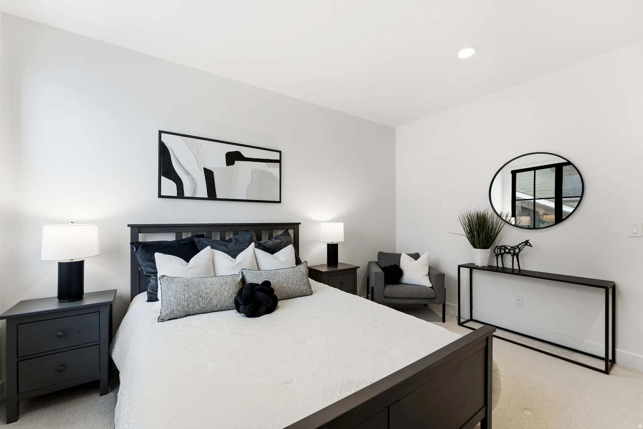 Bedroom with light carpet and recessed lighting