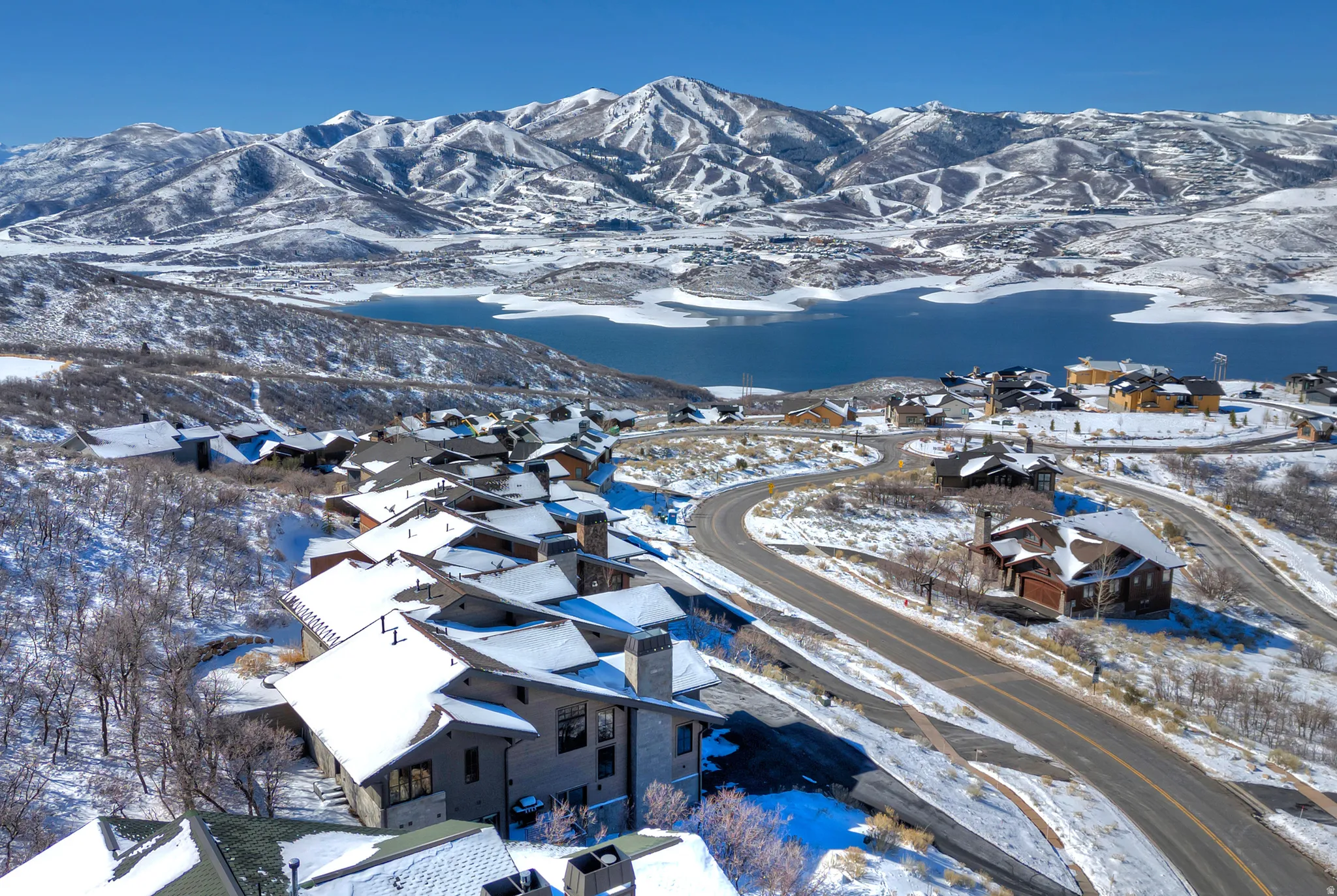 Snowy aerial view featuring a mountain view