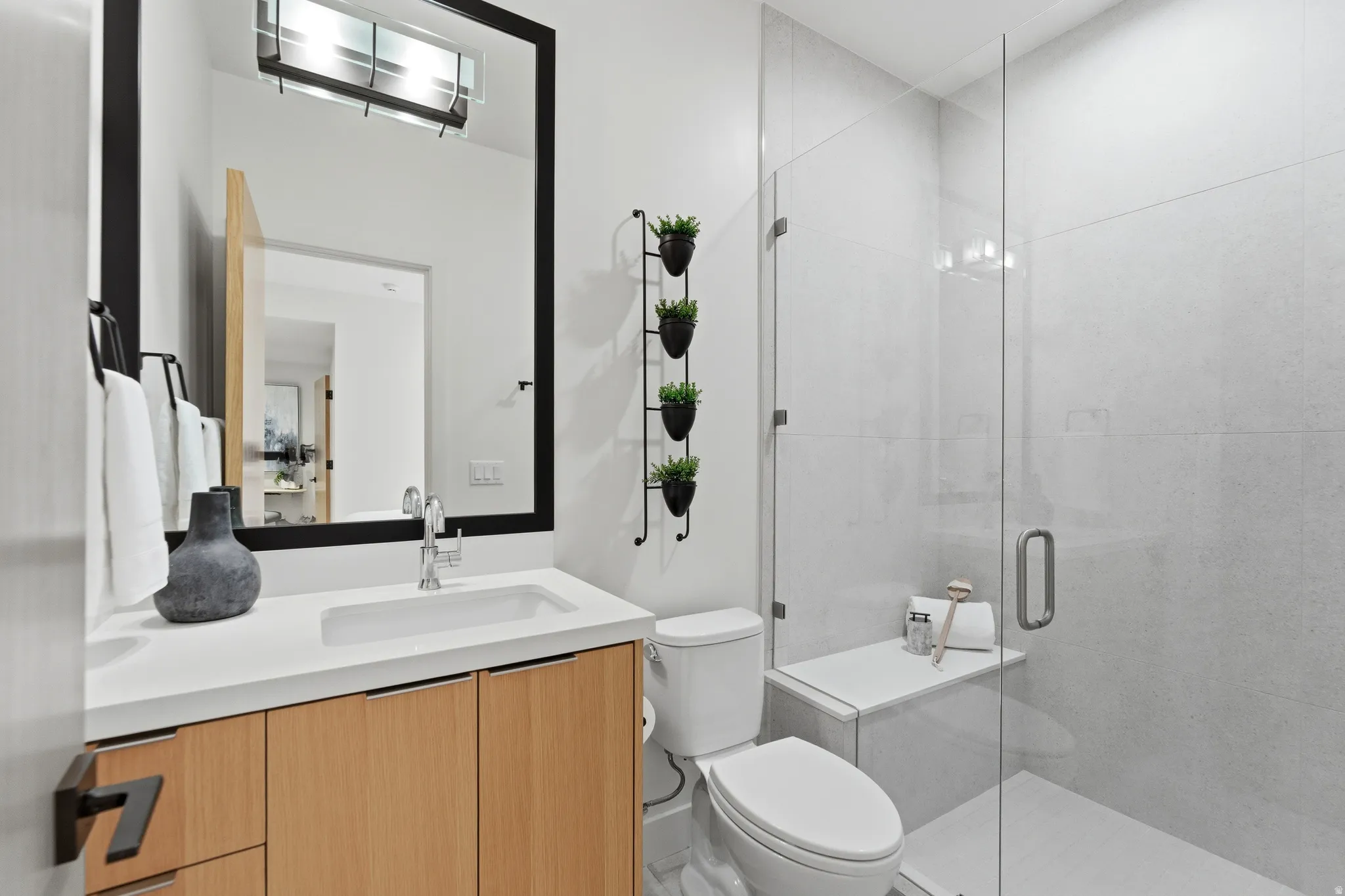 Full bath featuring vanity and a stall shower
